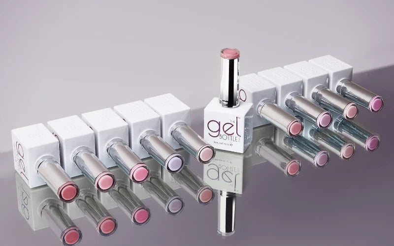 The GelBottle Fibre BIAB collection displayed on a mirrored surface.