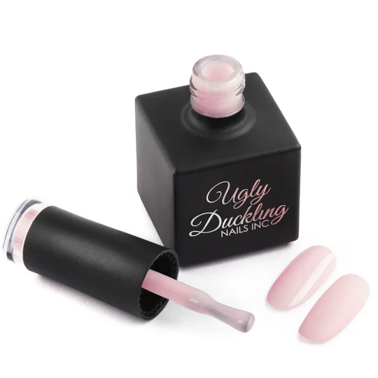 Ugly Duckling MILKY PINK Build-A-Base BIAB gel polish in 15ml bottle, showcasing the soft pink, creamy consistency, and branding.