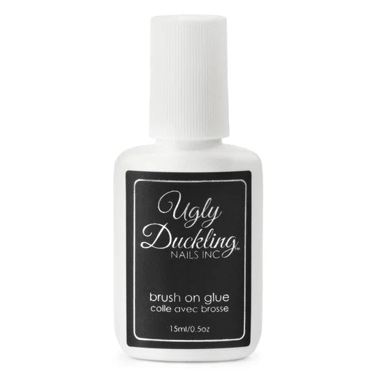 Ugly Duckling brush-on glue from Odds & Ends collection, showing the clear liquid adhesive in a small applicator bottle.