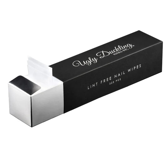 White lint-free nail wipes from Ugly Duckling, used as prep materials for nail art and manicure preparation.